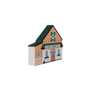 3/4" thick wooden illustration of a model of a building with 'Lucky's Shamrock Inn' sign on a white background
