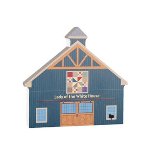 3/4" thick wooden illustration of a blue barn with quilt design and 'Lady of the White House' text on a white background