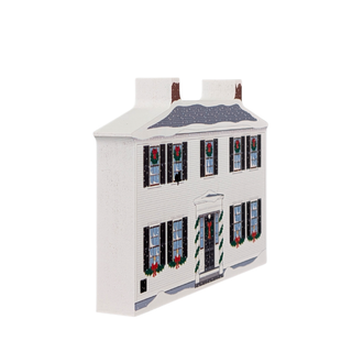 wooden replica with an illustration of a white house ornament with festive christmas window decorations on a white background