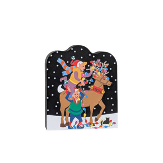 3/4" thick wooden replica with an illustration of a reindeer  and Christmas lights against a black background