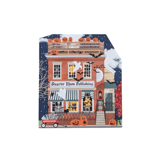 A square-shaped printed wood featuring a Halloween-themed illustration of a brick building with pumpkins, bats, ghosts, and a sign reading 'Quarter Moon Publishing.' The product is shown alone on a plain white background.