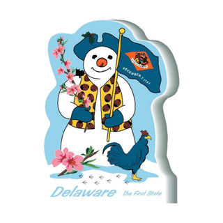 3/4" thick wooden Snowman with a Delaware flag and rooster, holding flowers, on a blue background