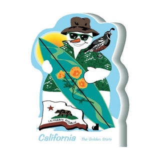 3/4" thick wooden snowman with a surfboard, sunglasses, and a hat, holding a California flag.