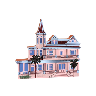 3/4" thick wooden Illustration of a pink house with a steeple and palm trees