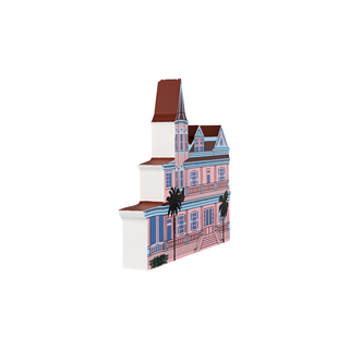 3/4" thick wooden Illustration of a pink house with a steeple and palm trees