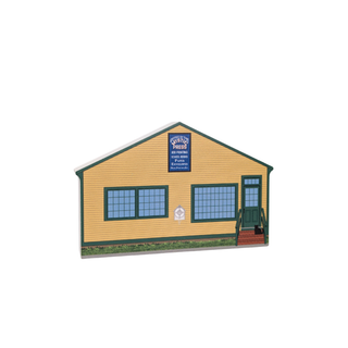 3/4" thick wooden Model of a small building with a sign on a white background