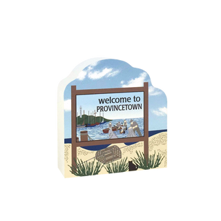 wooden replica design of a 'Welcome to Provincetown' sign with a beach scene and lobster trap.
