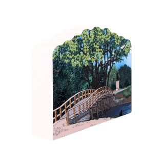 3/4" wooden replica with an illustration of a bridge and tree with a white background