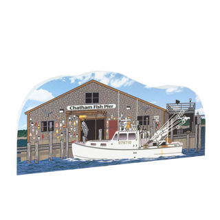wooden replica with an Illustration of Chatham Fish Pier with a boat docked in front