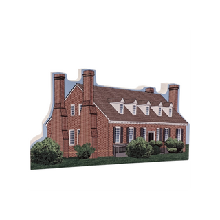 3/4" thick wooden cutout of  a brick house with white trim on a white background