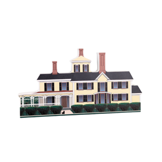 3/4" wooden replica with an illustration of a large two-story house with a white picket fence on a white background