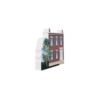 3/4" wooden replica with an illustration of a building with a brick facade and white accents on a white background