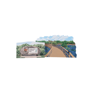 Scene of a 3/4" thick wooden illustration of a wooden trail over water and a sign on a white background