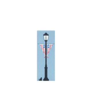 3/4" Wooden replica with a Lamp post with American flag design on a light blue background