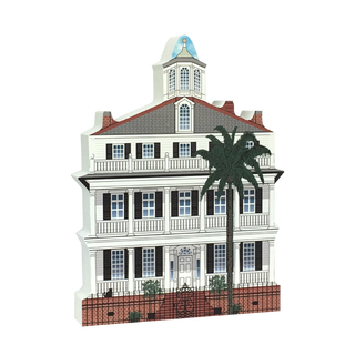 3/4" thick wooden Model of a building with a palm tree on a white background
