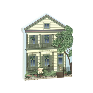 3/4" thick wooden Illustration of a two-story house with a tree in the foreground