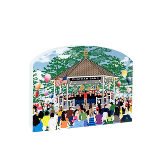wooden replica with a design of a bandstand with the chatham band and  people gathered around, set against a scenic background.