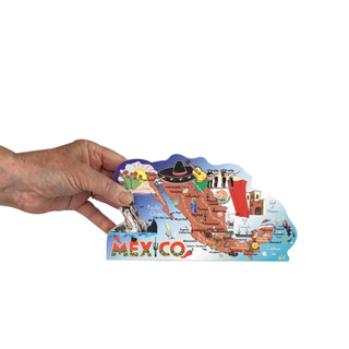 Hand holding a colorful 3/4" thick wooden cutout of a map of Mexico on a white background