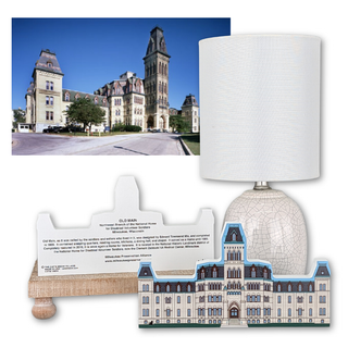 Lamp with decorative base featuring a building design, and a background image of a large building.