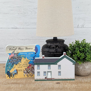 3/4" thick wooden illustration of a white house and a civil war map on display