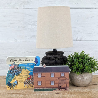 3/4" thick wooden illustrations of a house and civil war map on display
