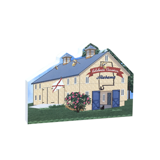3/4" wooden replica with an illustration of a barn with a blue roof and white walls, featuring a banner and flowers on a white background.