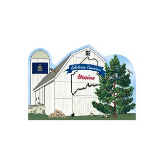 3/4" thick wooden Illustration of a barn with a tree, birds, and a flag, featuring 'Celebrate America Maine' text.
