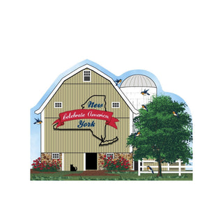 3/4" thick wooden Barn with 'New York Celebrate America' sign, surrounded by trees and flowers.