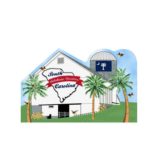 3/4" thick wooden cutout  of a barn with South Carolina outline and palm trees