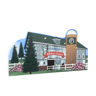 3/4" thick wooden cutout of  a barn with 'Washington Celebrate America' banner, trees, and flowers.