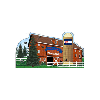 3/4" thick wooden Illustration of a red barn with a Colorado flag, surrounded by trees and flowers.