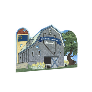 3/4" thick wooden Illustration of a barn with 'Celebrate America Nevada' text, surrounded by trees and flowers.