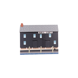 3/4" wooden replica with an illustration of a building labeled 'Sail Loft' on a white background