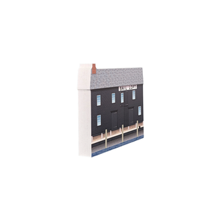 3/4" wooden replica with an illustration of a building with a sign on a white background