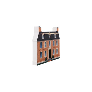 3/4" wooden replica with an illustration of a brick building with a black roof on a white background