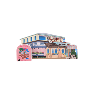 3/4" wooden replica with an illustration of a building with a 'Bubble Room' sign in front