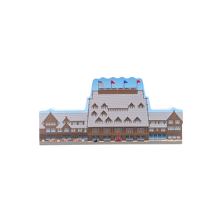3/4" wooden replica with an illustration of a building with a snowy roof and flags on a white background