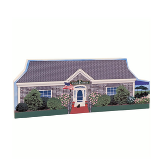 wooden replica of a house with an american  flag 