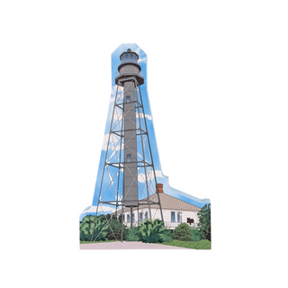 3/4" wooden replica with an illustration  of a Lighthouse with a house and trees on a white background