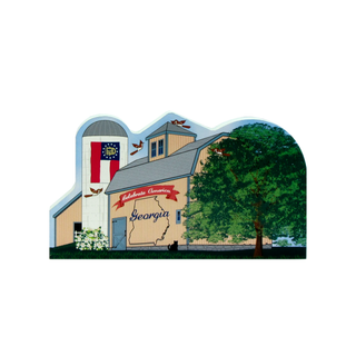 3/4" thick wooden Illustration of a barn with a Georgia state design and American flag, surrounded by trees.