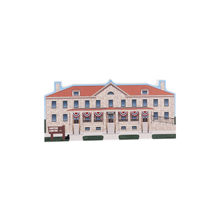 3/4" wooden replica with an illustration of a stone building with decorative elements on a white background