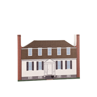 3/4" thick wooden cutout of  a two-story house with a brown roof, white walls, and red brick accents.