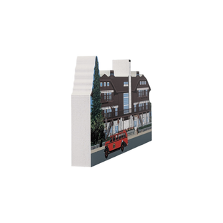 3/4" thick wooden illustration of a building with a red bus in front on a white background