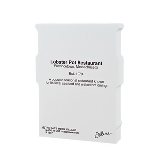Wooden replica with black text about Lobster Pot Restaurant on a white background