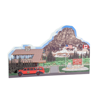 3/4" thick wooden illustration of a memorabilia cutout with a red bus, building, and mountain landscape.