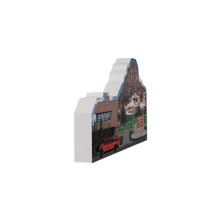 3/4" thick wooden illustration of a memorabilia cutout with a red bus, building, and mountain landscape.