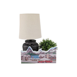 3/4" thick wooden illustration of a mountain resort with buildings and a lake, featuring two red buses on display