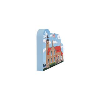 3/4" wooden replica with an illustration  of a lighthouse with a red roof and an American flag on a white background