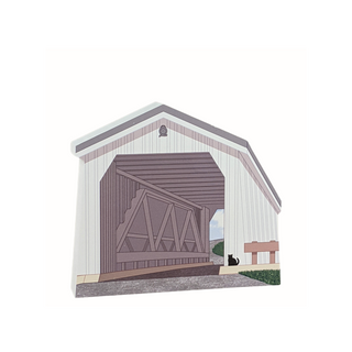 3/4" thick wooden Model of a covered bridge with a cat sitting outside on a white background