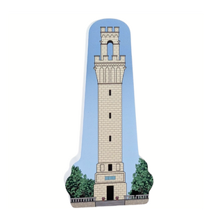 Wooden replica of  the Pilgrim Monument with descriptive text on a white background